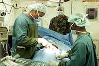 Surgeons performing and operation.